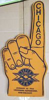 Front of orange foam finger showing CHICAGO and Super Bowl XX logo