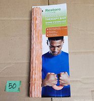 Front of Gaiam Restore Hand & Arm Therapy Bar on backing card