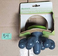 Front view of massager inside original packaging showing product and color