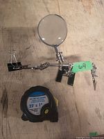 Overall view of helping hands magnifier and WorkForce tape measure