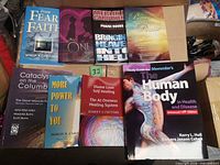 All eight books laid out, full cover view