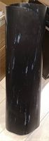 Mat rolled showing marbled black surface