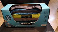Front of boxed Havasu Watersports Powell inflatable belt-pack PFD