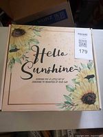 Closed Hello Sunshine gift box with sunflower graphics