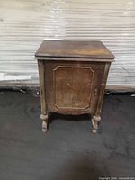 Closed wood cabinet showing overall form