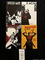 Group shot of all four Marvel trade paperbacks