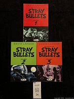 Front view of all three Stray Bullets volumes together