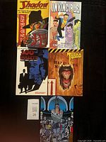 All five comic books laid out for identification