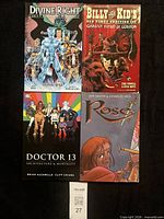 Group shot of all four comic trade paperbacks