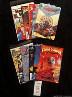 All ten comics fanned out on black background