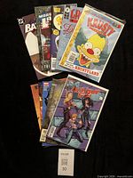 Stack of 10 bagged comic books showing assorted titles