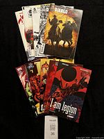 All ten comic books fanned out showing covers