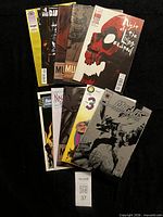 All ten comics fanned out showing front covers