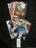 Fanned stack of 10 comic books