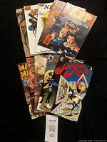 Stack of ten comic books fanned out