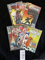 All six bagged comics fanned out