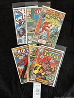 All six bagged comics laid out