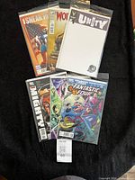 All six bagged comics laid out