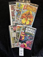 Six bagged comics fanned out