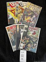 Six bagged Marvel comics fanned out