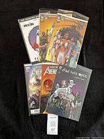 All six bagged comic books fanned out