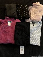 All six folded garments displayed