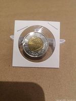 Reverse view of $2 coin in flip