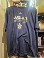 Front full view of Adidas Toronto Marlies Climalite shirt on hanger