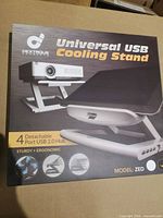 Front of box showing Universal USB Cooling Stand imagery and features