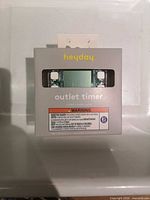 Front of sealed Heyday outlet timer box showing branding and product