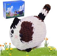 Front of completed cat plush example and branded box