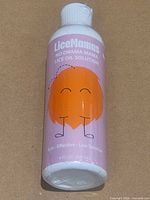 Front of sealed LiceMamas No Drama Mama lice oil solution bottle