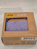 Front of retail box showing OtterBox Core Series lavender confetti case for AirPods Pro 2