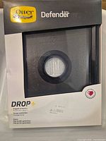 Front of retail box displaying OtterBox Defender Series DROP+ case