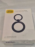 Front of OtterBox Lumen Series AirTag holder box showing product image and details