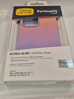 Front of retail package showing OtterBox Symmetry MagSafe ultra-slim case and feature list