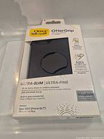 Front of sealed OtterBox OtterGrip Symmetry Series case packaging