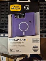 Retail-boxed purple OtterBox Series Frē MagSafe case showing front of packaging and product features
