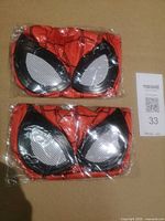 Two packaged red Spider-Man style mask fronts