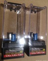 Front view of both packaged mortising bits showing labels and bit profile