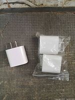 Three chargers: one loose, two sealed
