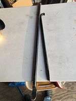 both pry bars full length on table