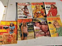 Six magazines laid out showing covers