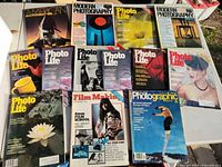 Tabletop view of all magazines laid out in two rows showing titles and cover art