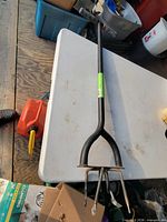 Full view of Fiskars extended reach tiller on table
