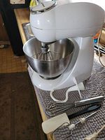Stand mixer with bowl and attachments visible