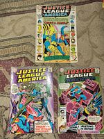 All three Justice League comics laid out