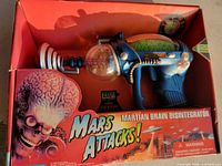 Front of boxed Mars Attacks Martian Brain Disintegrator showing toy and graphics