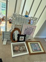 Group shot of mirrors, canvas, framed prints, glass dish