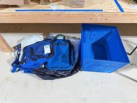 Overall lot with blue storage bin and assorted bags